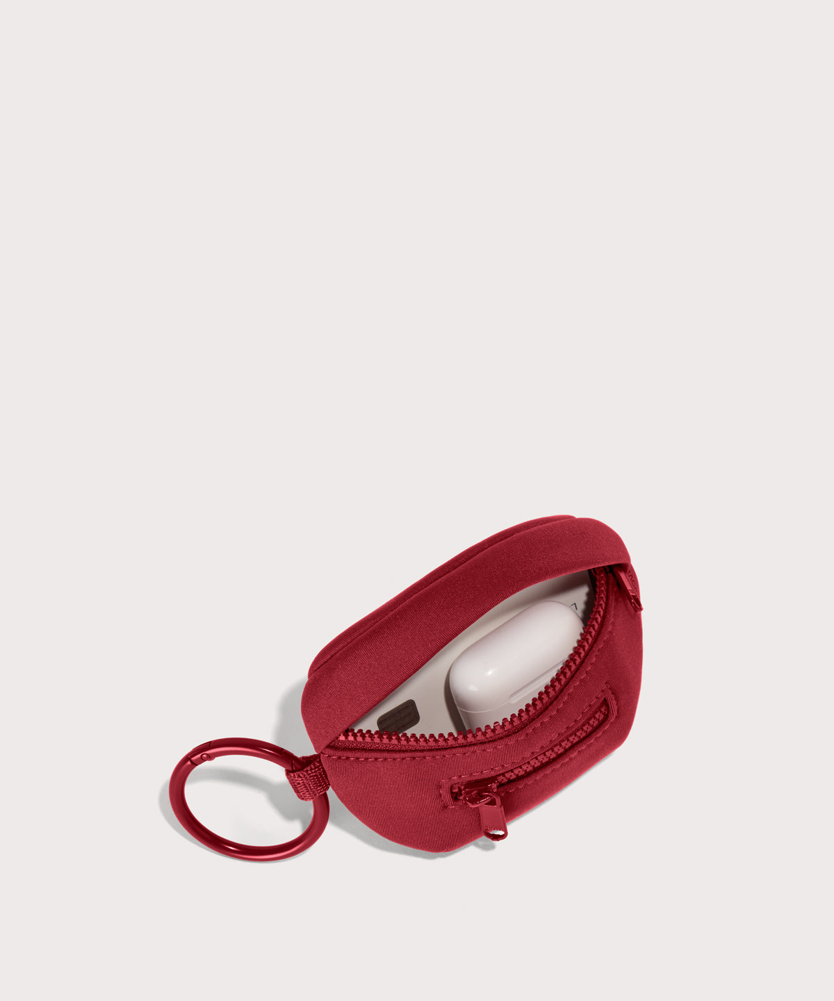 Dagne Dover Ace Keychain in a punchy, saturated deep red unzipped, showing interior.
