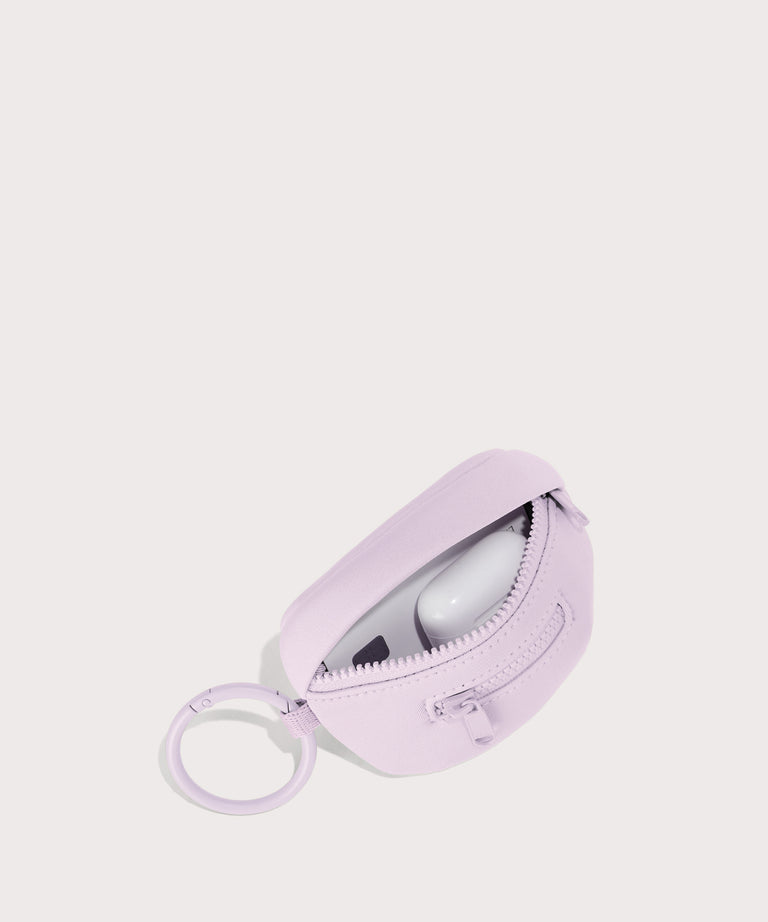 Dagne Dover Ace Keychain in a soft purple with grey undertones unzipped, showing interior.
