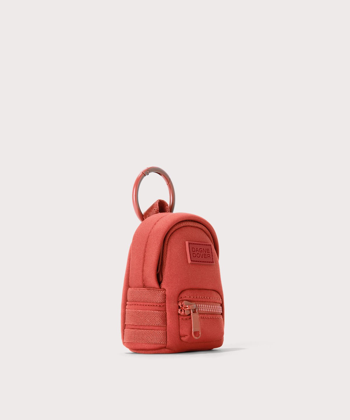 Dagne Dover Dakota Keychain in  a poppy, vintage wash red seen from an angle.
