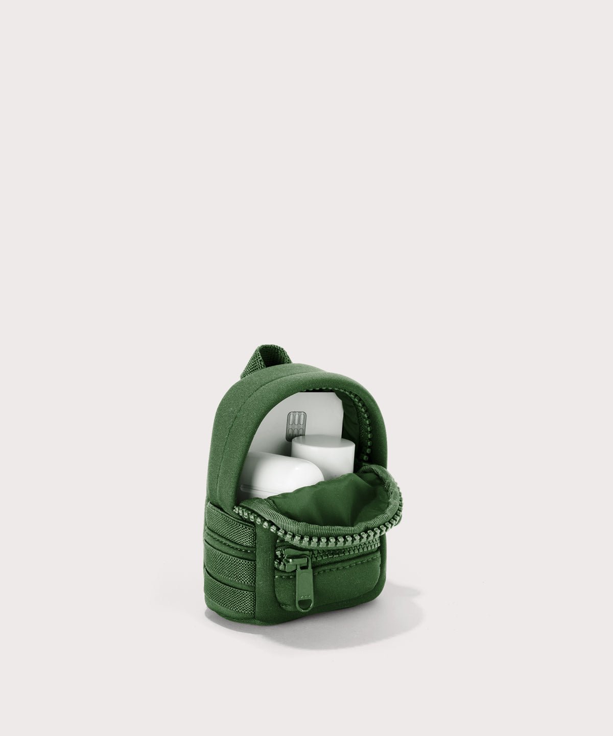 Dagne Dover Dakota Keychain in a rich, classic forest green unzipped, showing interior.
