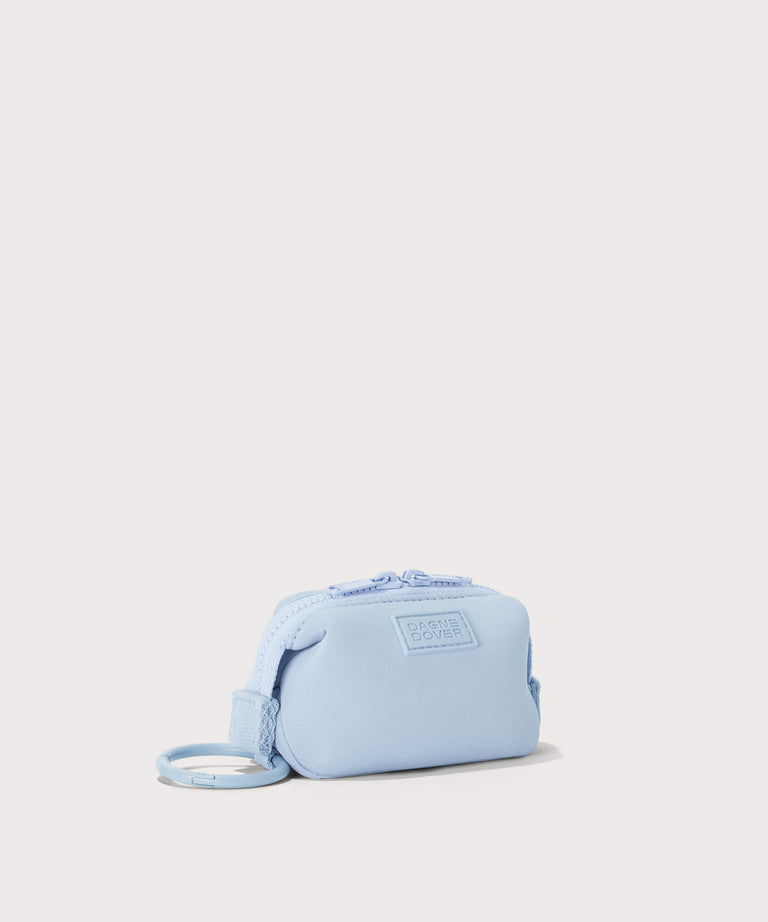 Dagne Dover Hunter Keychain in an airy, lighter sky blue seen from an angle.
