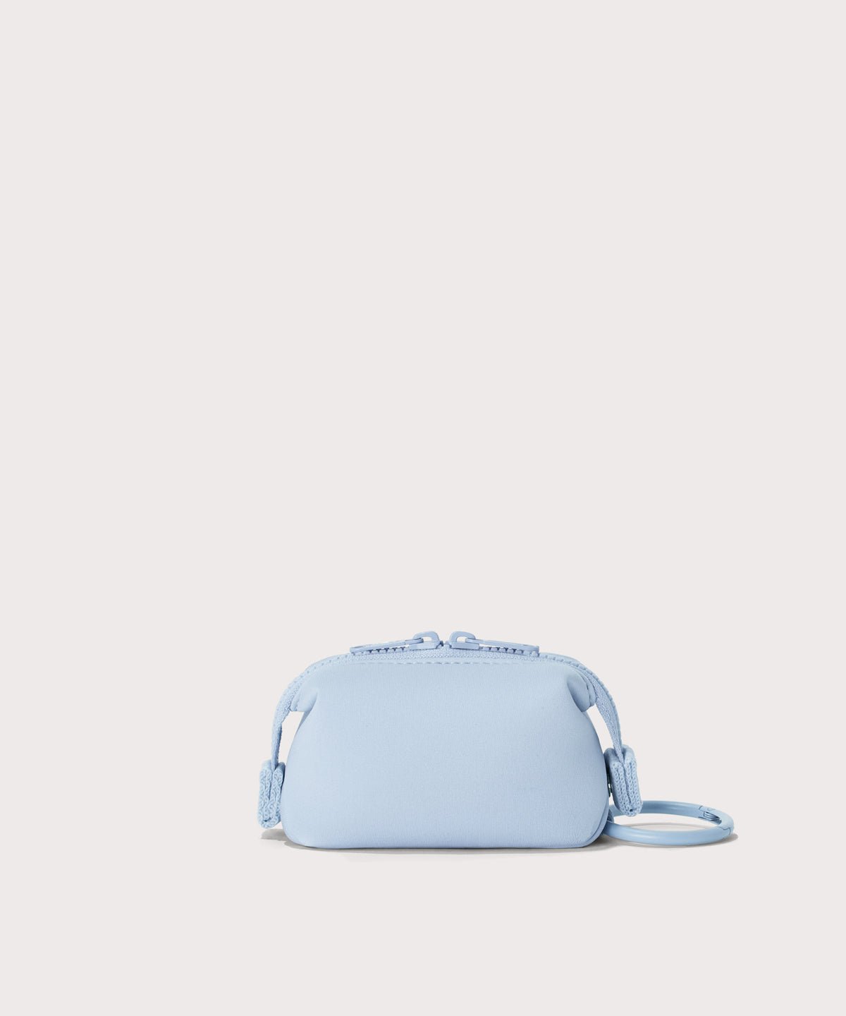 Dagne Dover Hunter Keychain in an airy, lighter sky blue seen from the back.
