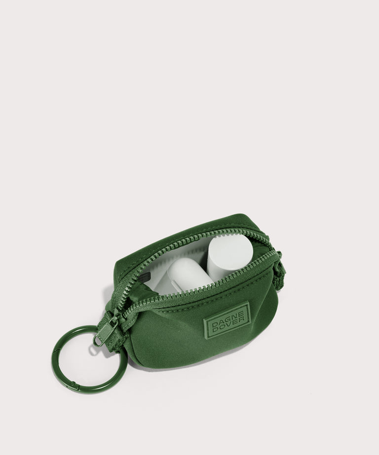 Dagne Dover Hunter Keychain in a rich, classic forest green unzipped, showing interior.
