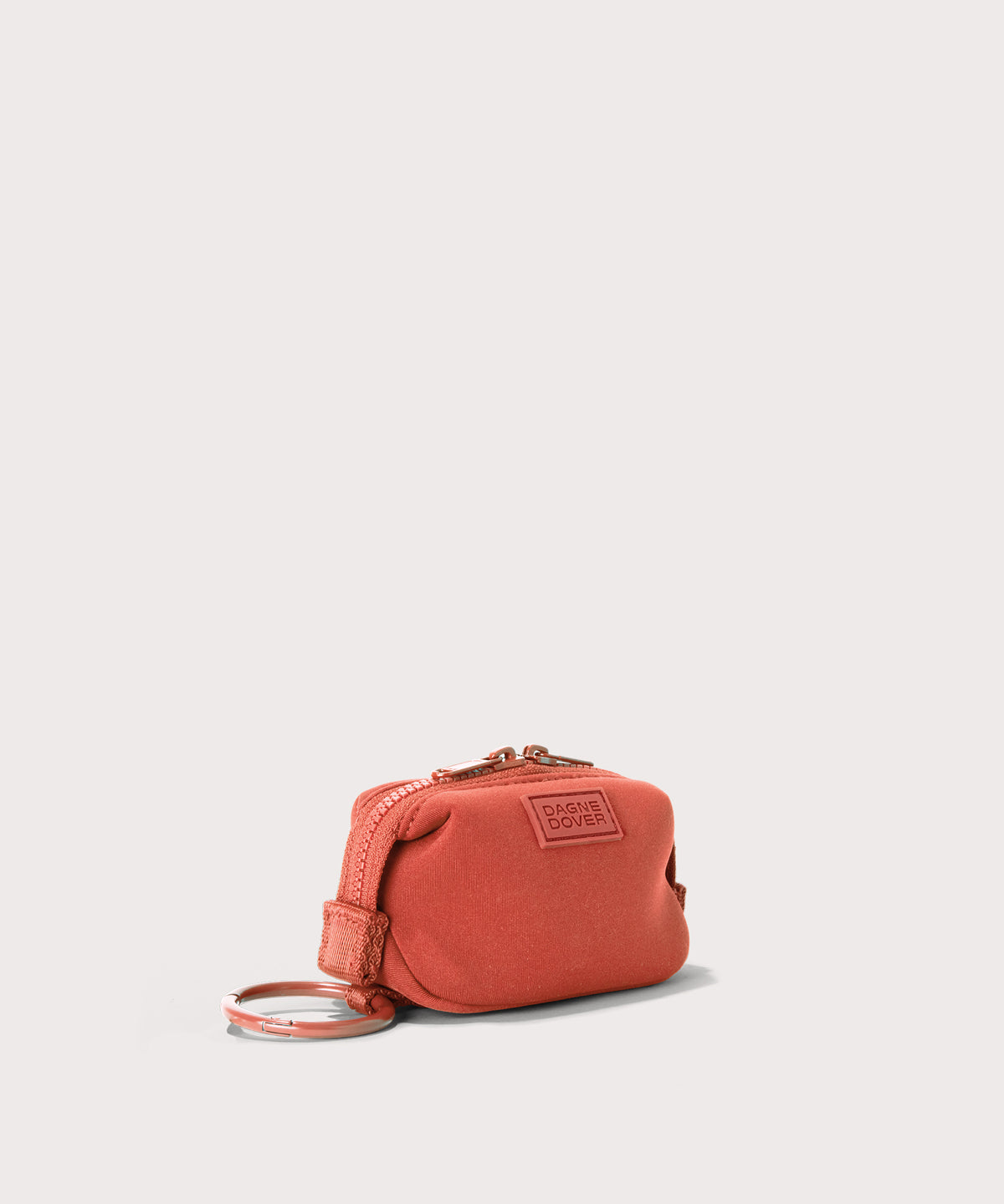 Dagne Dover Hunter Keychain in a poppy, vintage wash red seen from an angle.
