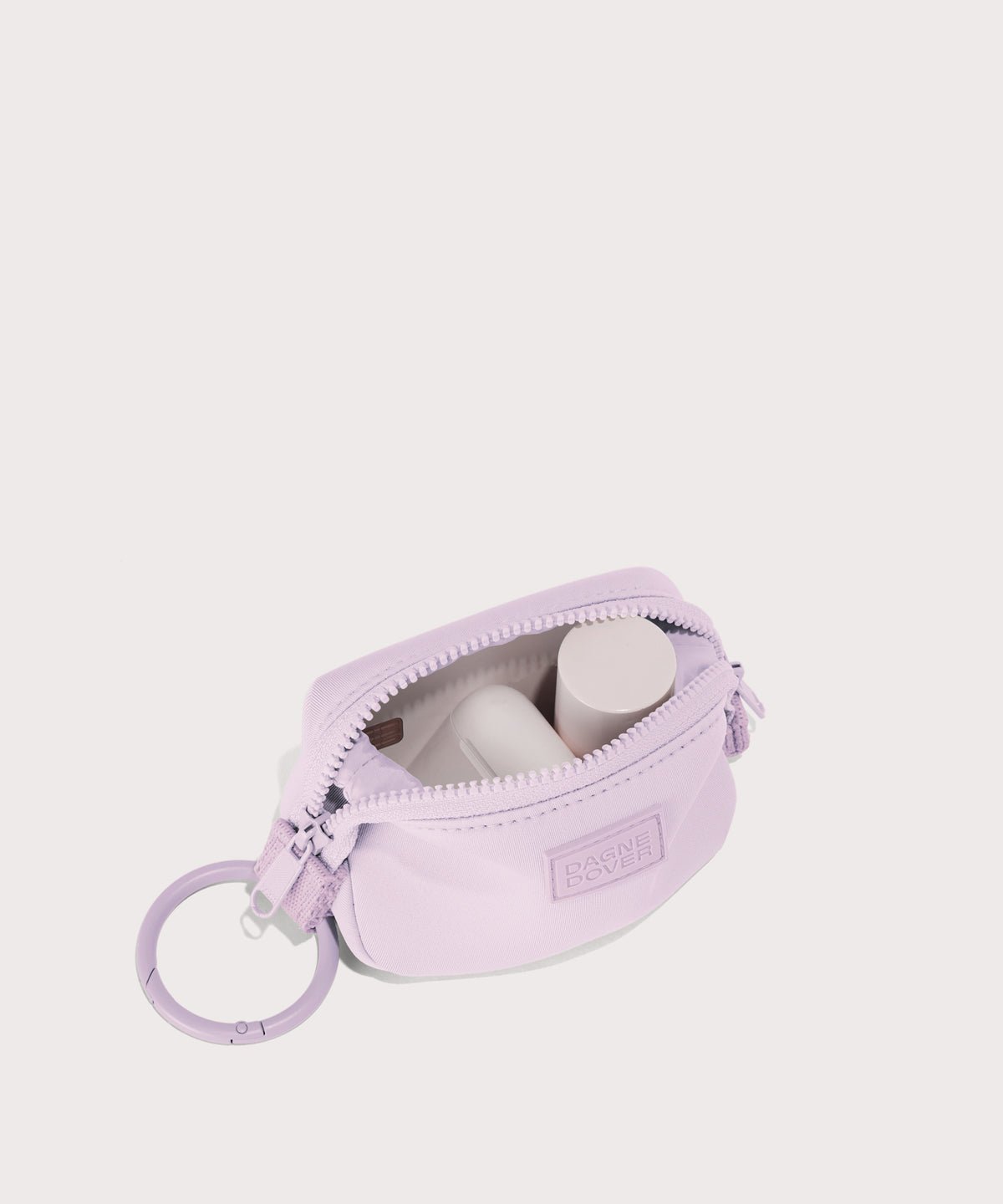 Dagne Dover Hunter Keychain in a soft purple with grey undertones. unzipped, showing interior.
