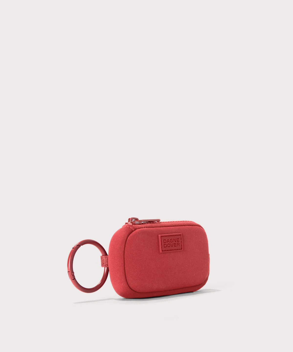 Dagne Dover Mara Keychain in a poppy, vintage wash red seen from an angle.
