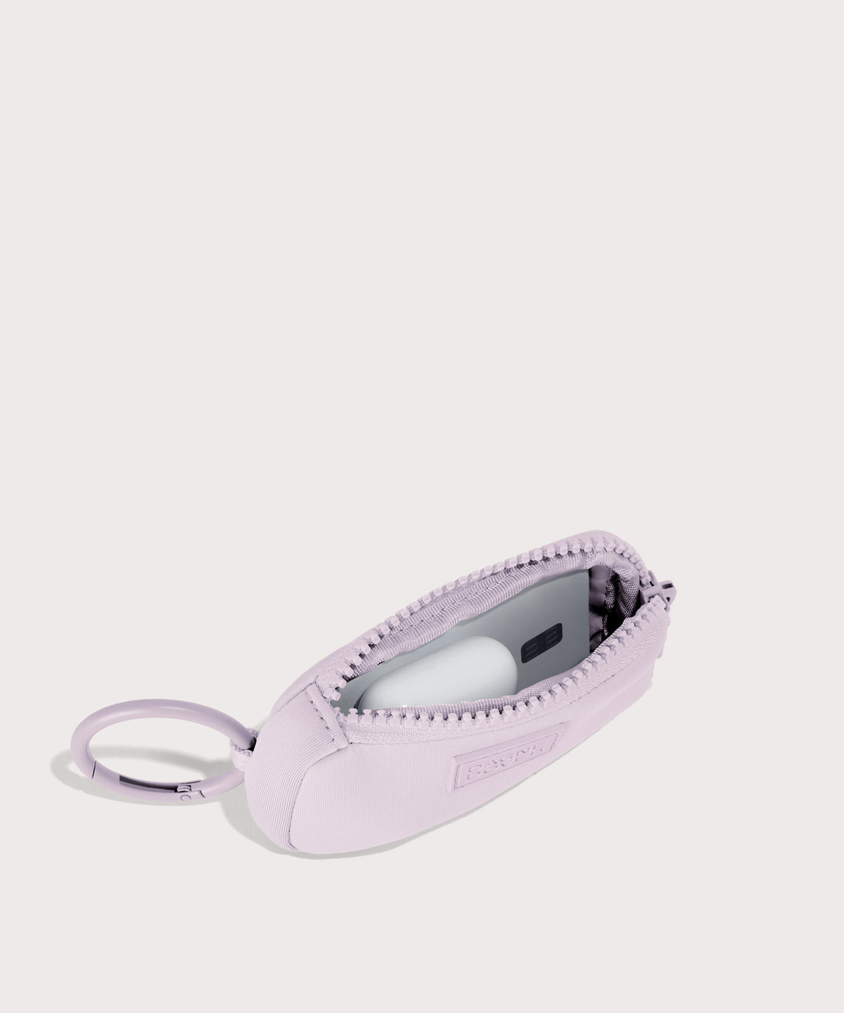 Dagne Dover Mara Keychain in a soft purple with grey undertones unzipped, showing interior.

