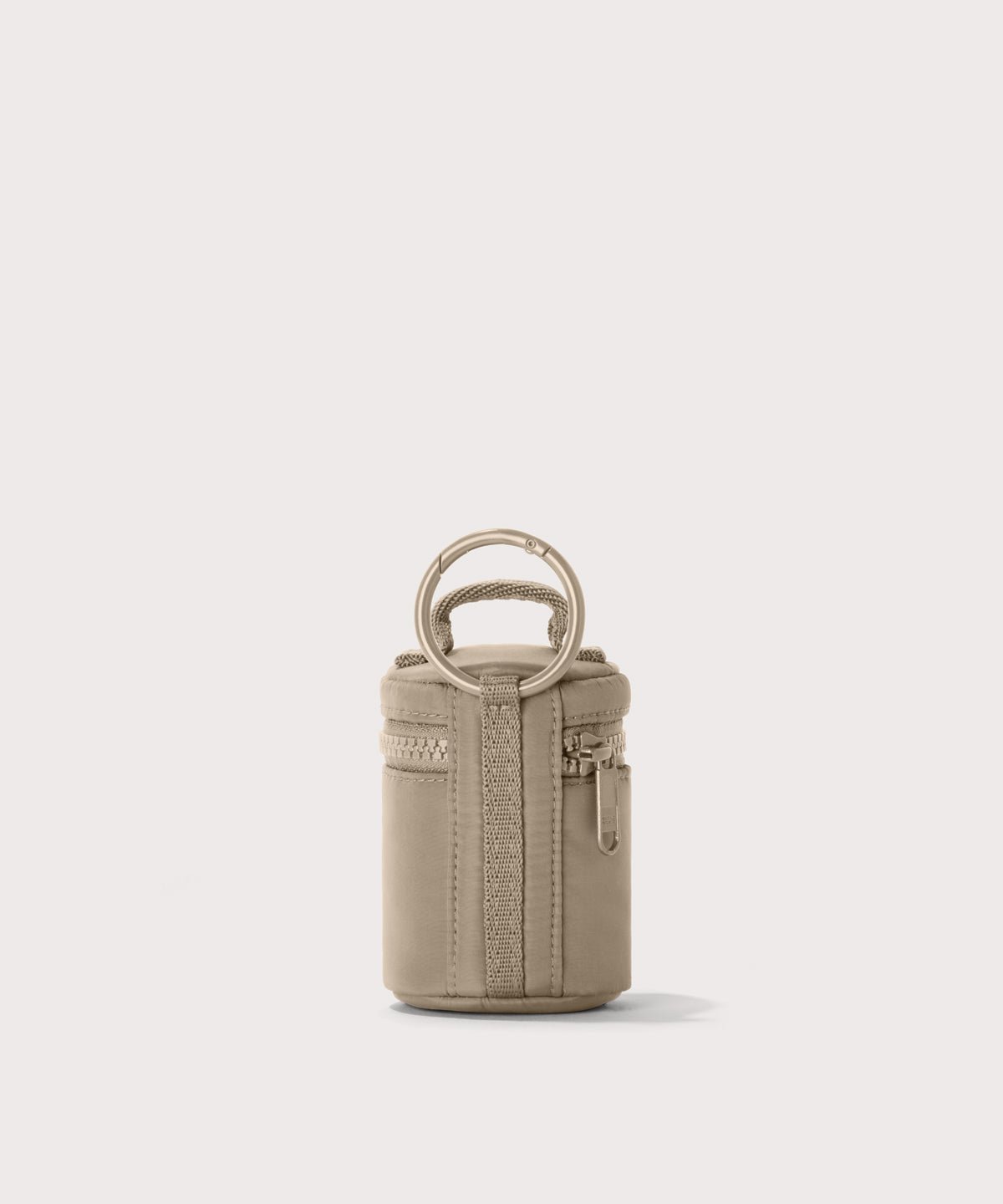 Dagne Dover Mila Keychain in a medium-dark, creamy tan seen from the back.
