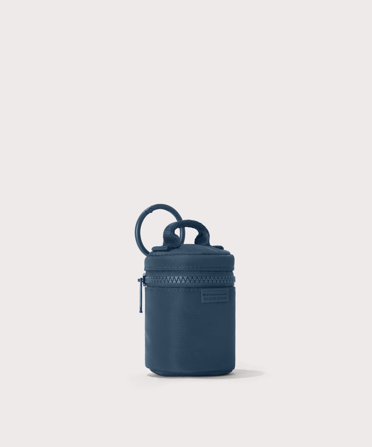 Dagne Dover Mila Keychain in a medium grey-blue with a touch of turquoise seen from an angle.

