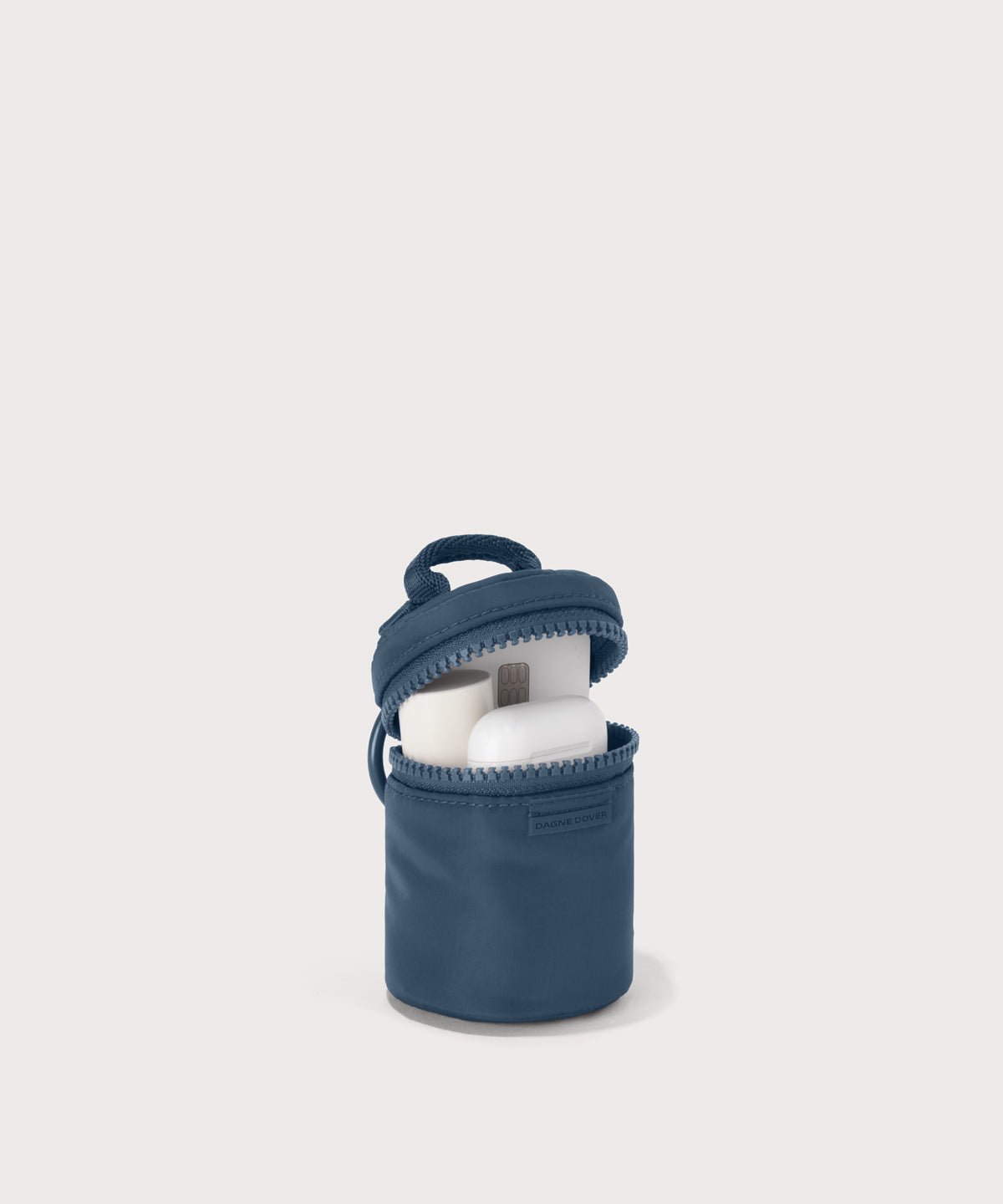Dagne Dover Mila Keychain in a medium grey-blue with a touch of turquoise unzipped, showing interior.
