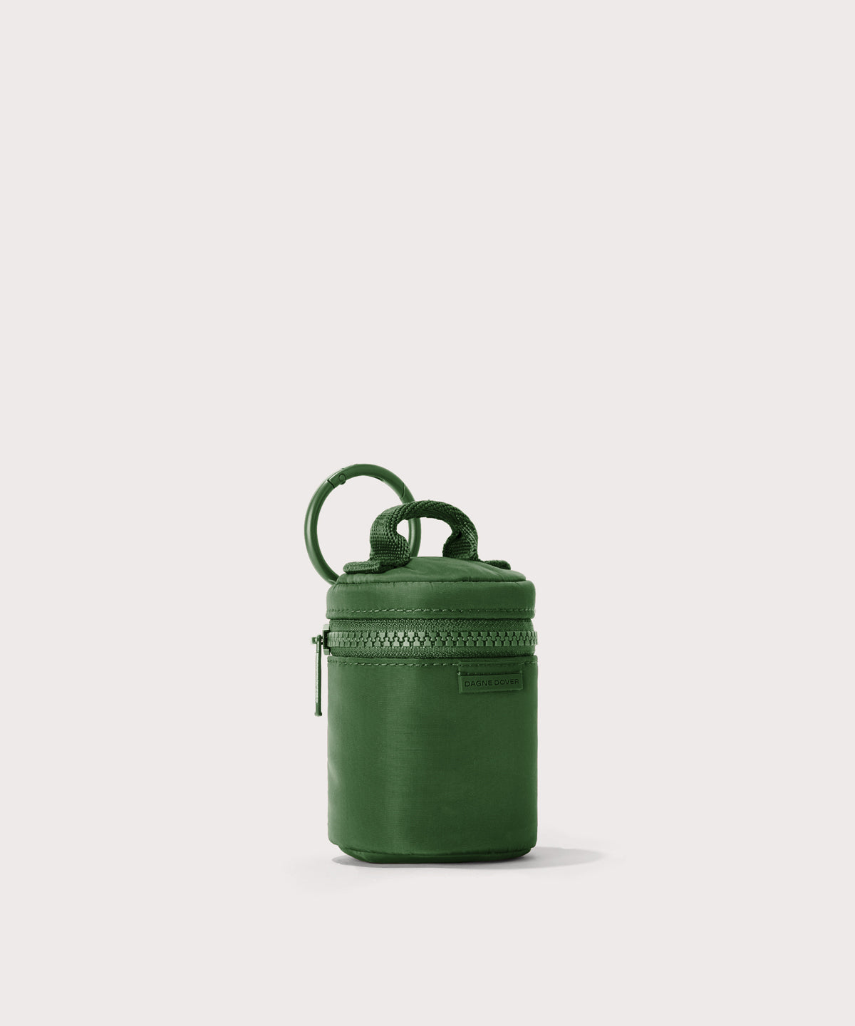Dagne Dover Mila Keychain in a a rich, classic forest green seen from an angle.
