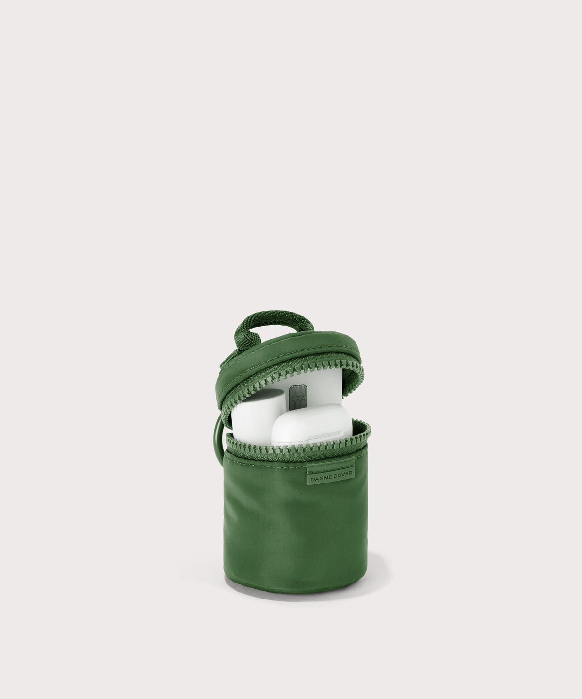 Dagne Dover Mila Keychain in a a rich, classic forest green unzipped, showing interior.
