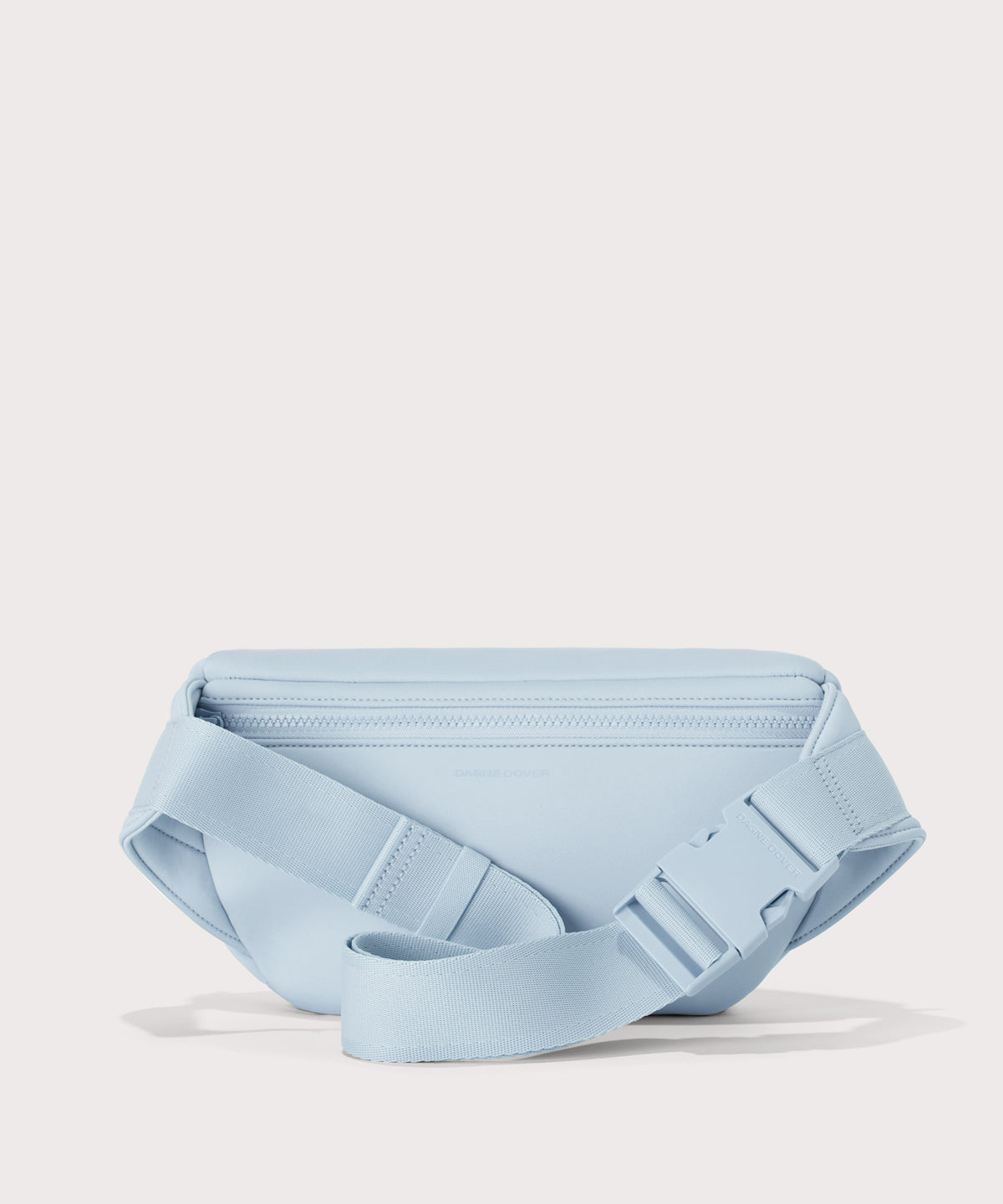 Dagne Dover jax large fanny pack in an airy, lighter sky blue seen from the back.
