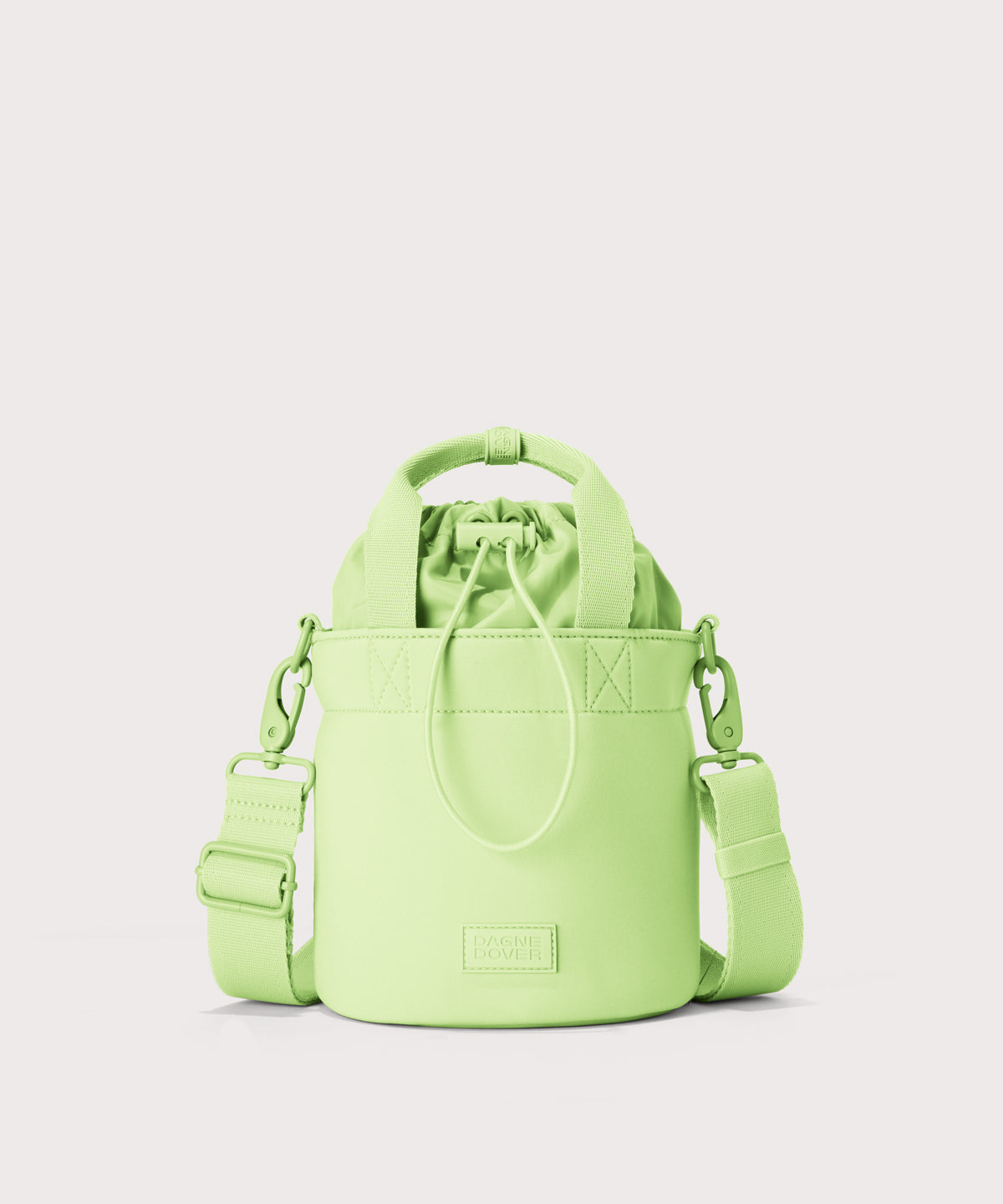 Dagne Dover Nico Bucket Bag in matcha.
