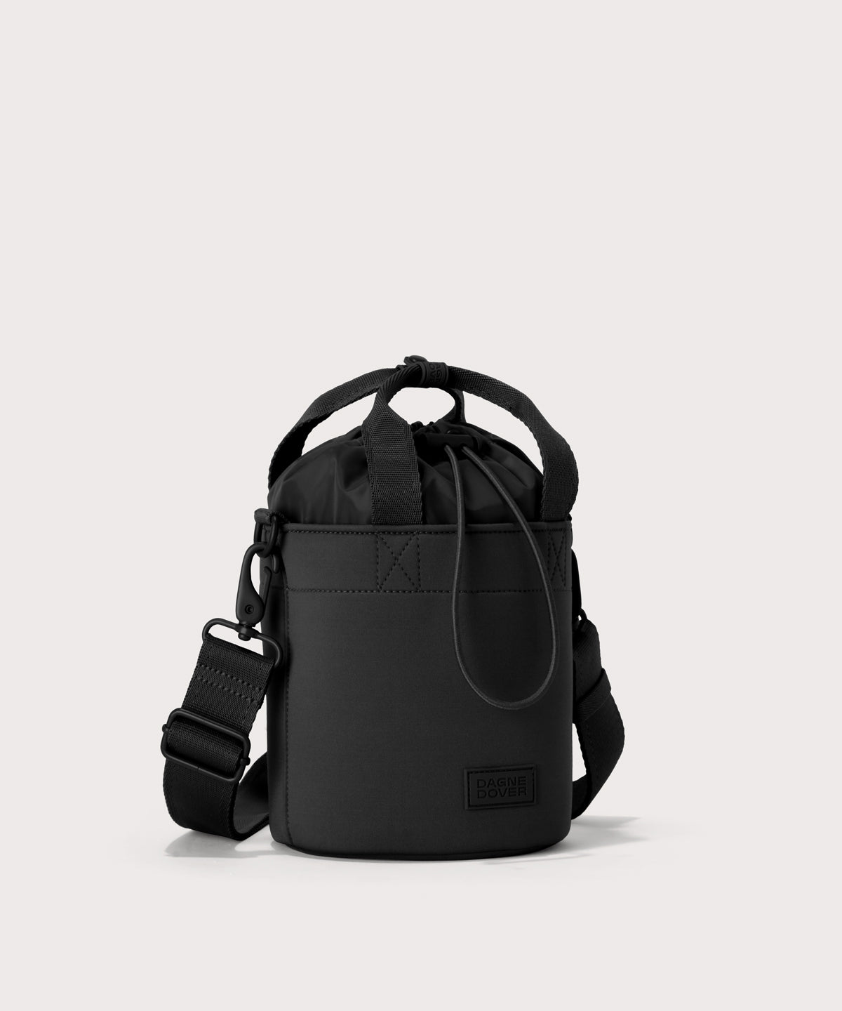 Dagne Dover Nico Bucket Bag in black, side angle.

