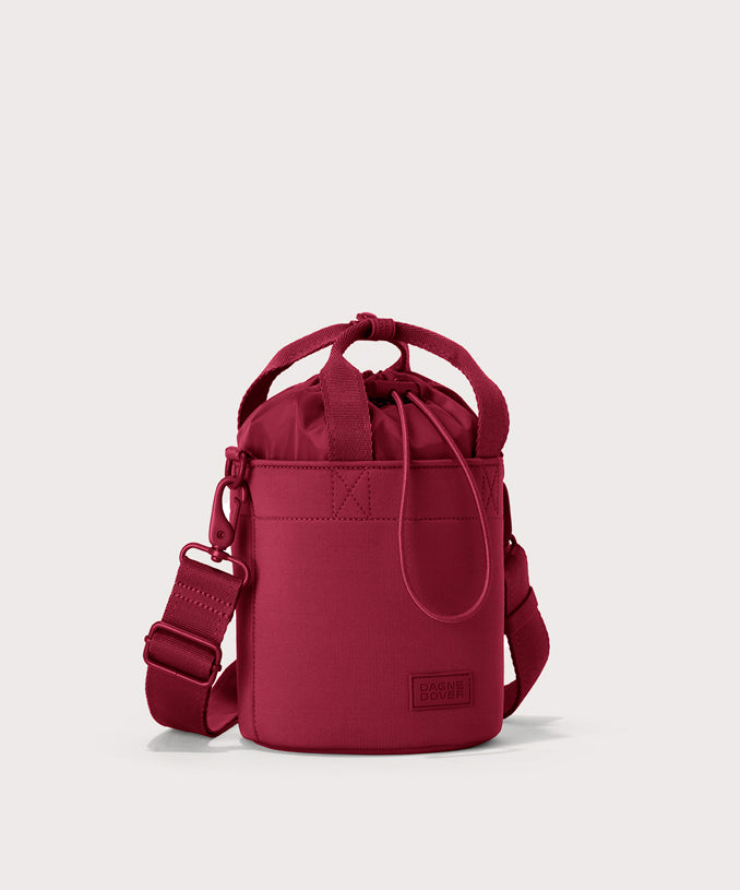 Dagne Dover Nico Bucket Bag in Spice, side angle.
