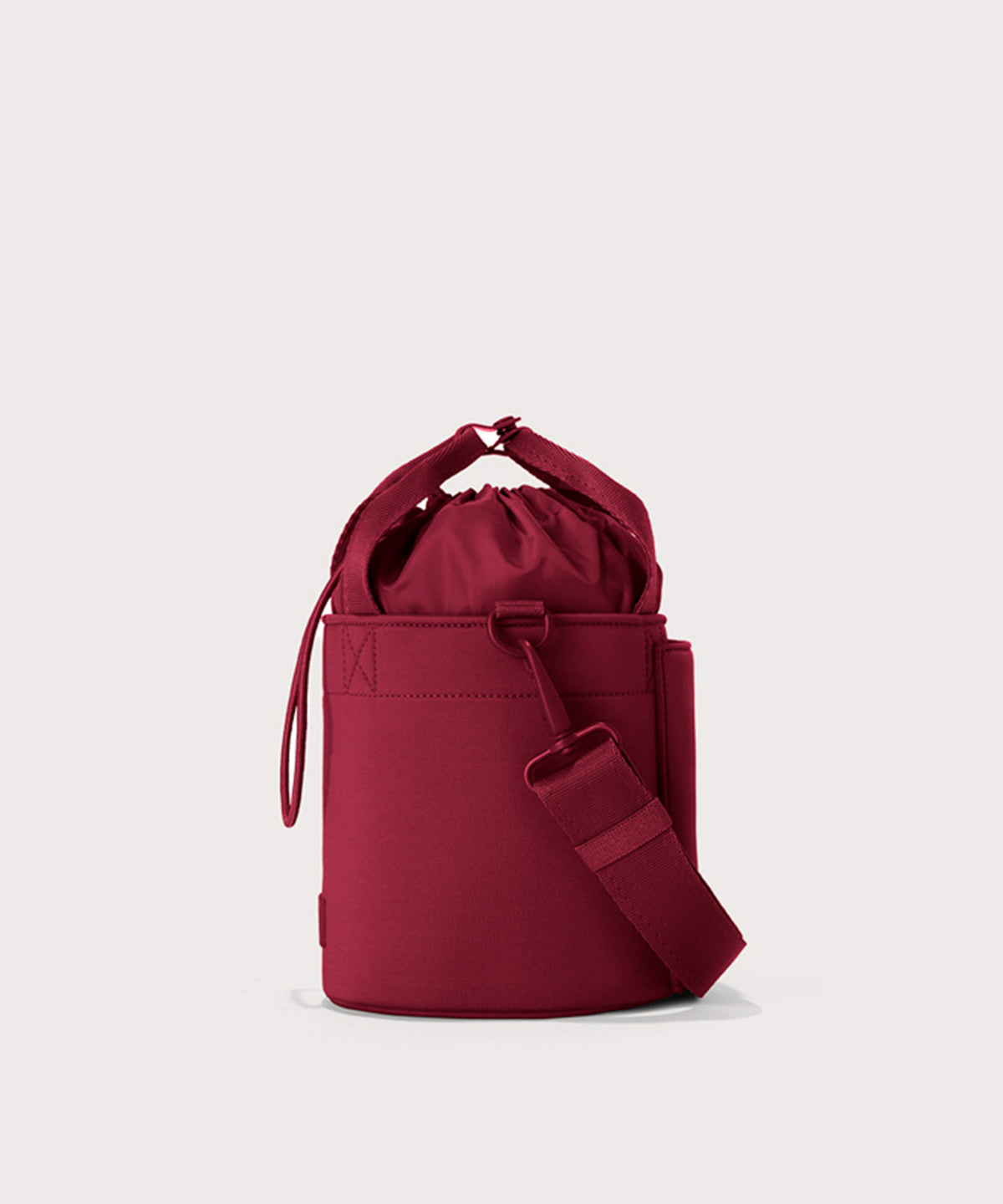 Dagne Dover Nico Bucket Bag in Spice, side angle.
