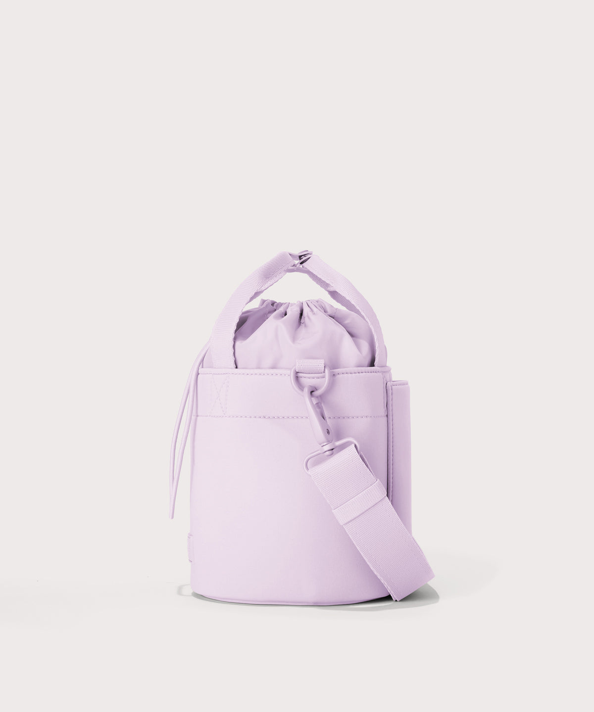 Dagne Dover Nico Bucket Bag in a soft purple with grey undertones, side angle.

