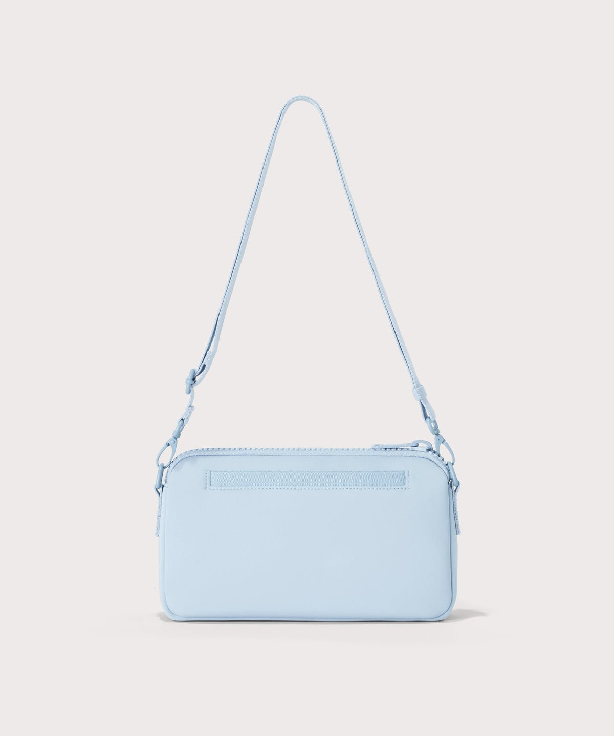 Dagne Dover Nora Shoulder Bag in an airy, lighter sky blue, back angle.
