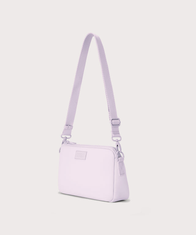 Dagne Dover Nora Shoulder Bag in  a soft purple with grey undertones, side angle.
