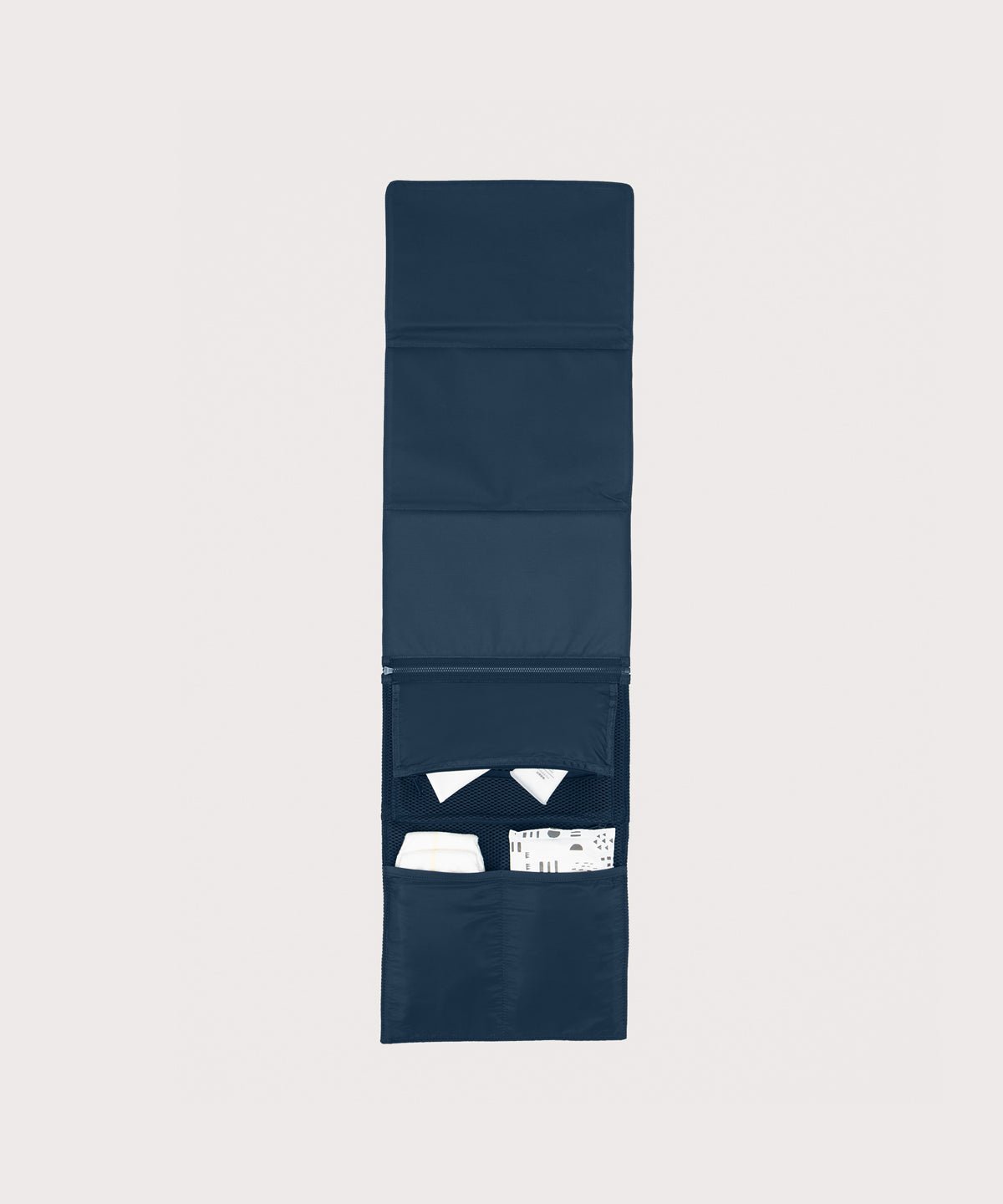 Dagne Dover Joey Changing Kit in moonlight unfolded, revealing the interior zipper pocket and interior slip pockets.
