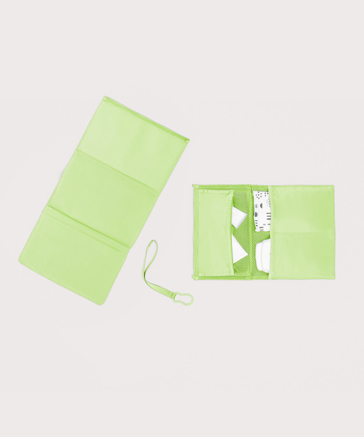 Dagne Dover Joey Changing Kit in matcha unfolded, revealing the detachable changing mat.
