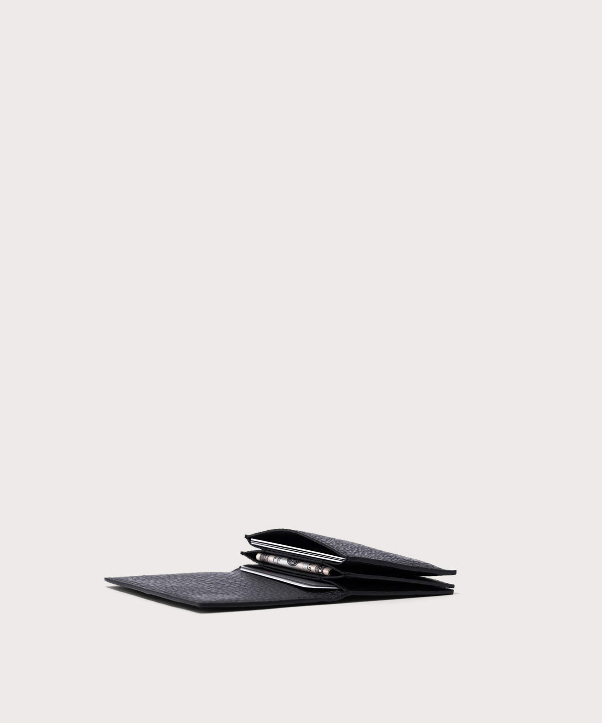 hover - Dagne Dover Accordion Card Case in black opened, revealing the three internal gusseted card slots.