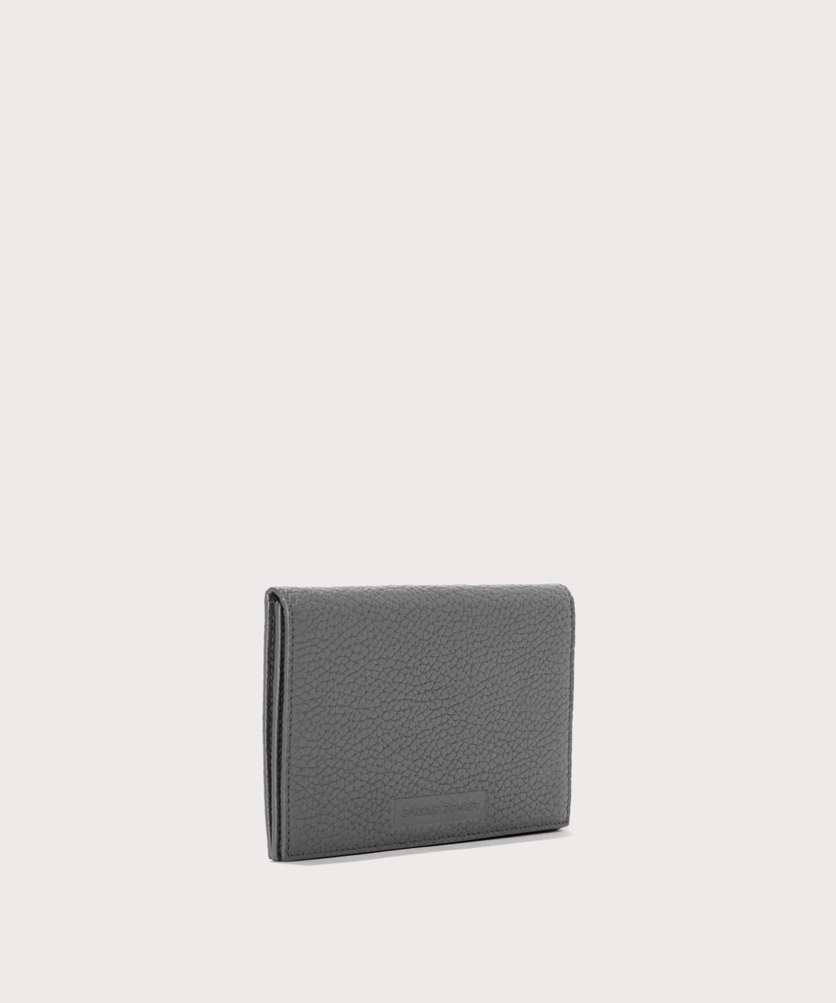 Dagne Dover Accordion Travel Wallet in grey seen from an angle.
