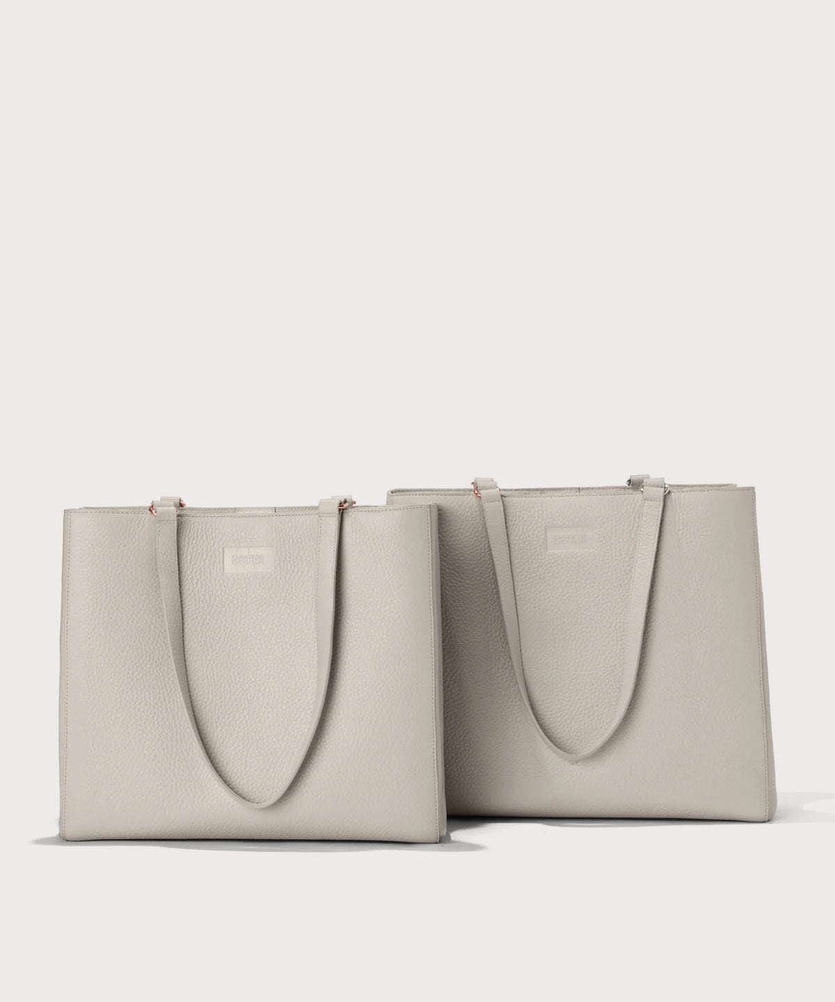 Dagne Dover medium and large Allyn Totes in grey.
