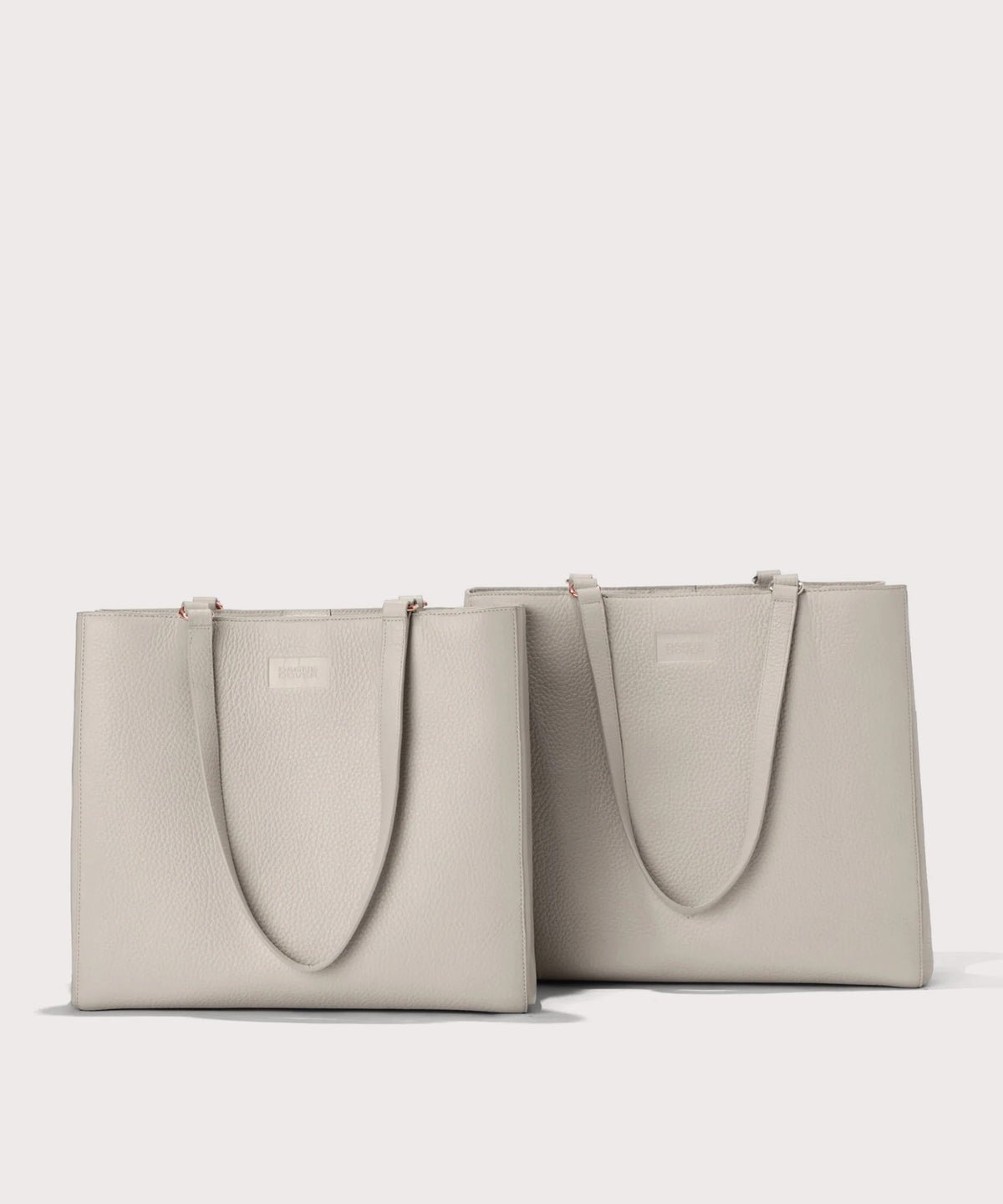 Dagne Dover medium and medium Allyn Totes in light grey.