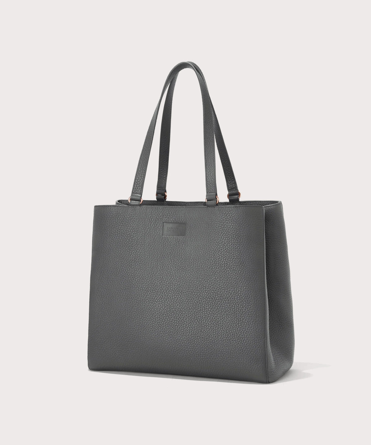 Dagne Dover large Allyn Tote in grey seen from an angle.
