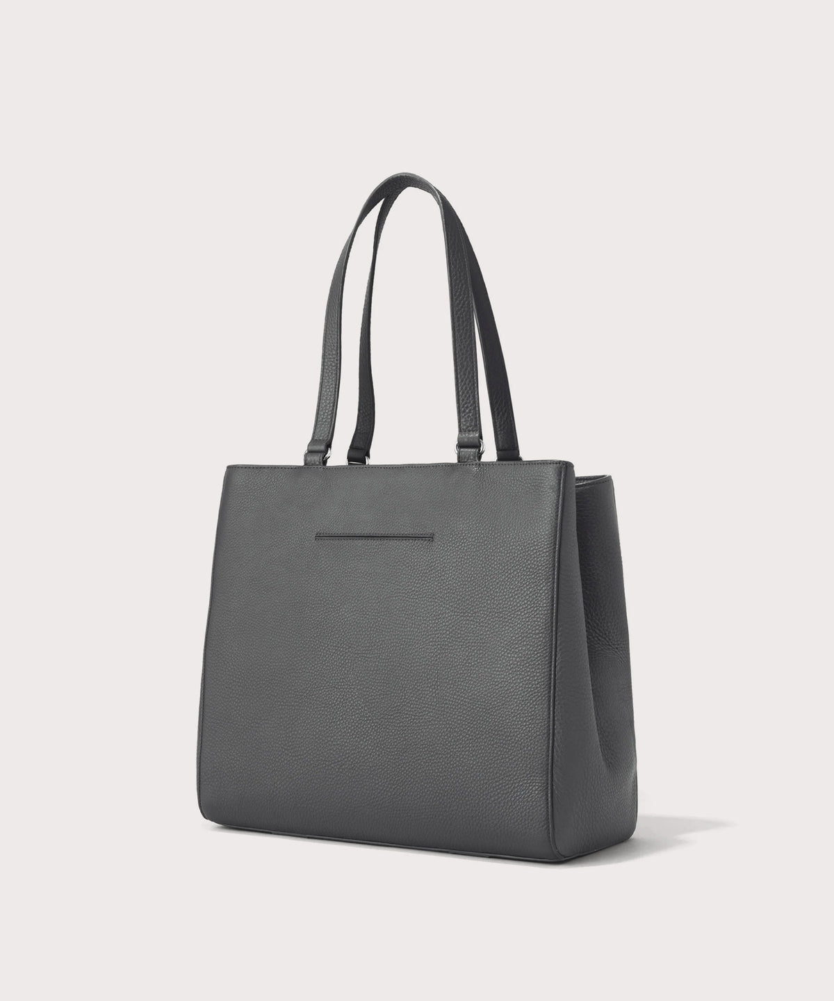 Dagne Dover large Allyn Tote in grey with the exterior slip pocket.
