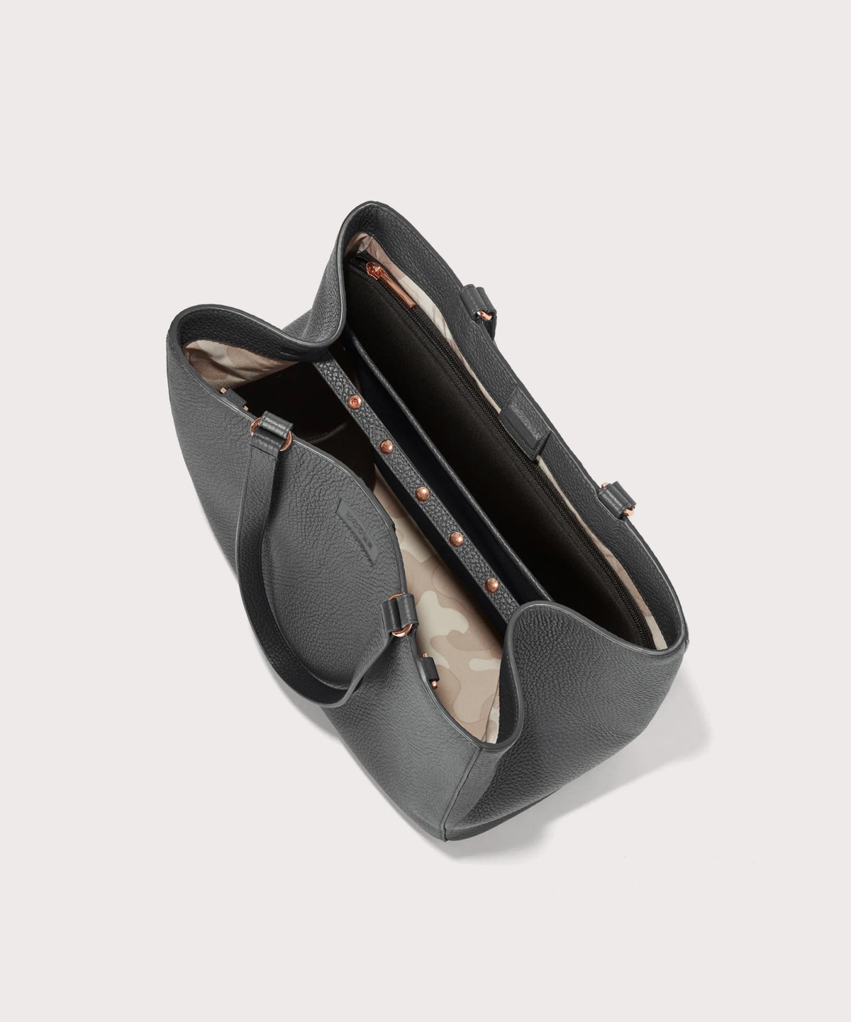 Dagne Dover large Allyn Tote in grey seen from above, revealing the interior slip pockets and laptop sleeve.
