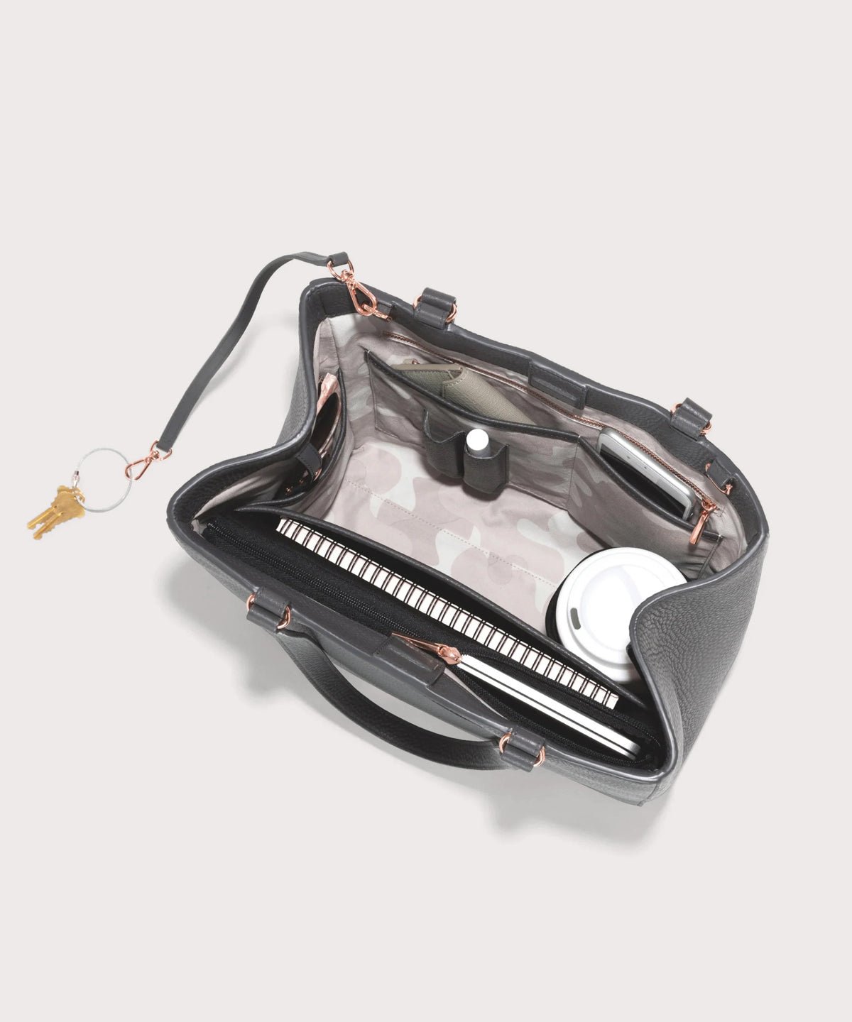 Dagne Dover medium Allyn Tote in grey seen from above, revealing the interior slip pockets and laptop sleeve.
