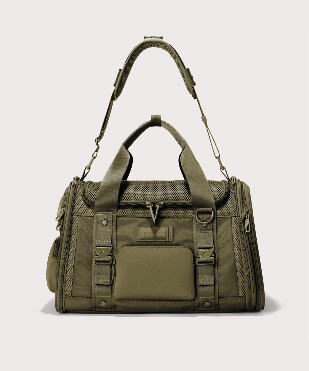 Dagne Dover Large Kyoto Pet Carrier in a deep olive green seen from the front with crossbody strap.
