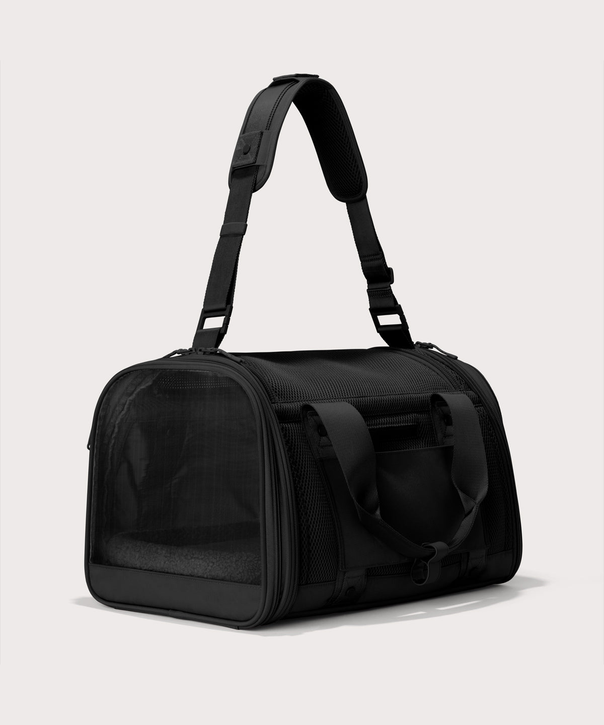 Dagne Dover Large Kyoto Pet Carrier in black seen from a back angle with crossbody strap.

