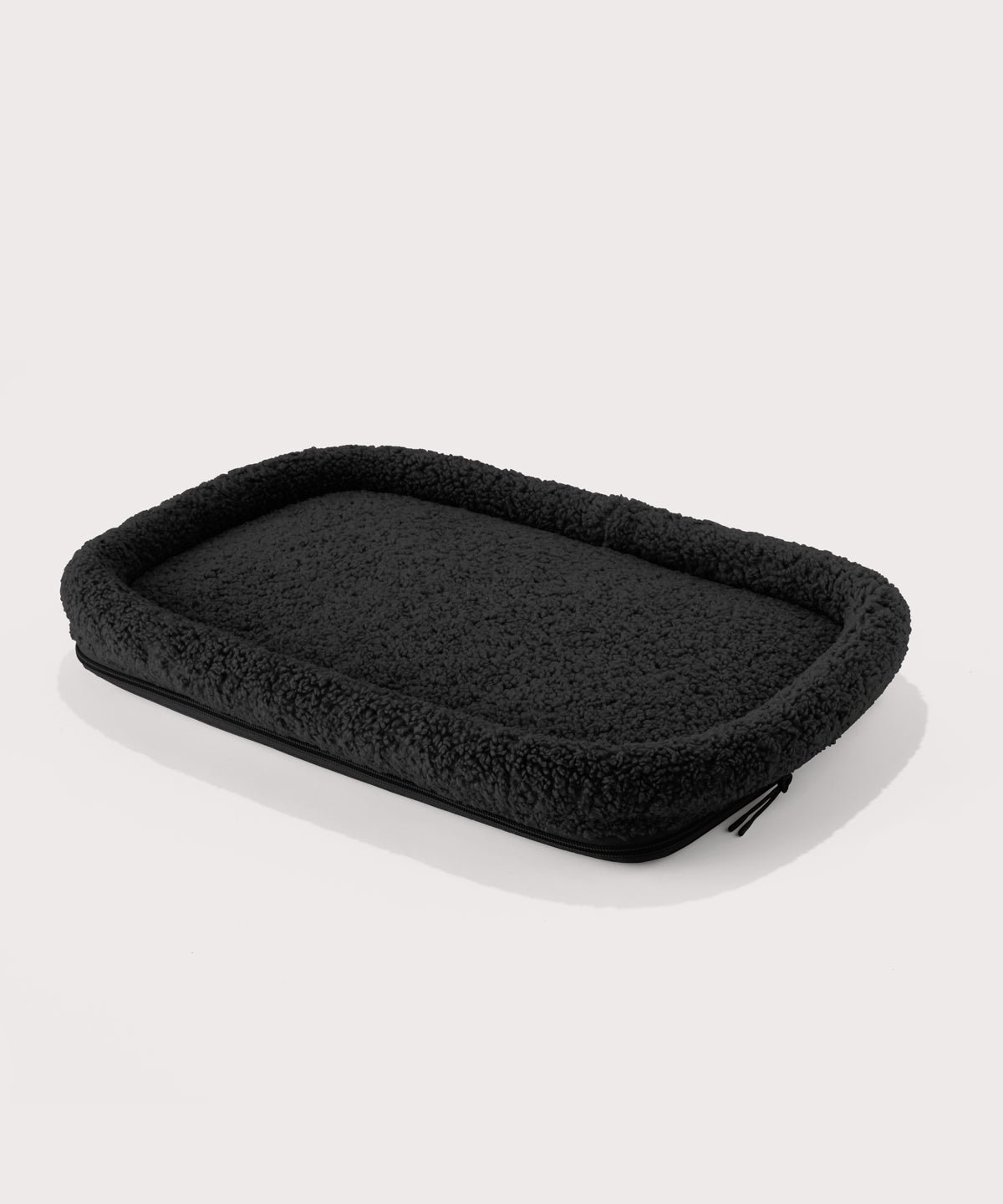 Dagne Dover Large Kyoto Pet Carrier removable padded faux sherpa pet bed in black.
