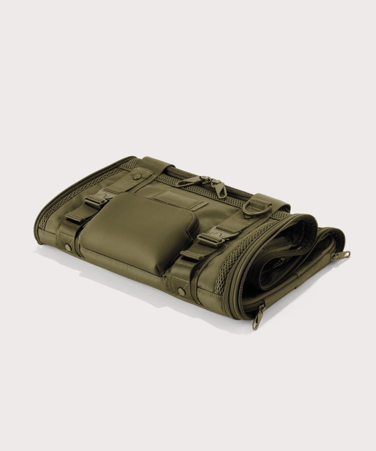 Dagne Dover small Kyoto Pet Carrier in a deep olive green folded flat.

