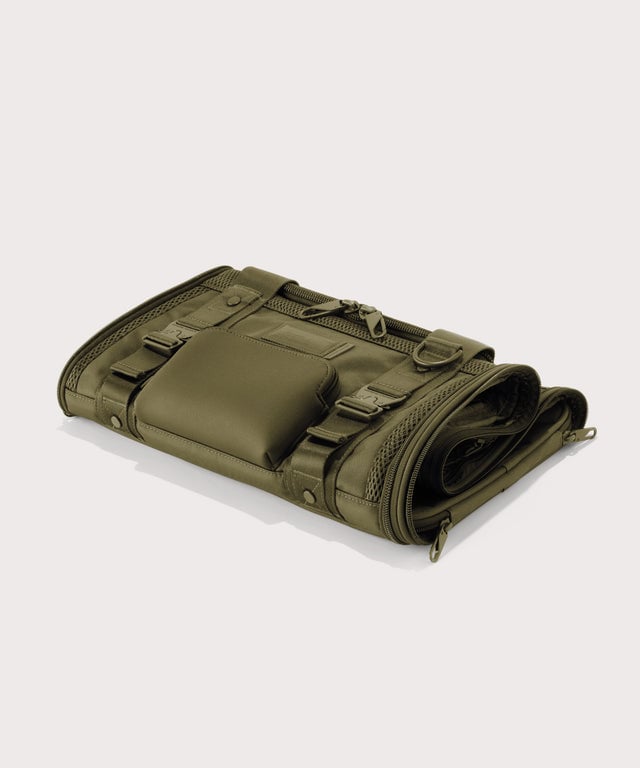Dagne Dover small Kyoto Pet Carrier in a deep olive green folded flat.
