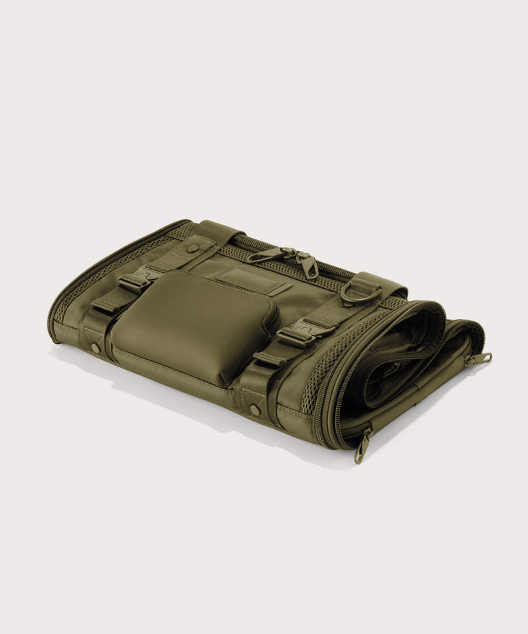 Dagne Dover small Kyoto Pet Carrier in a deep olive green folded flat.
