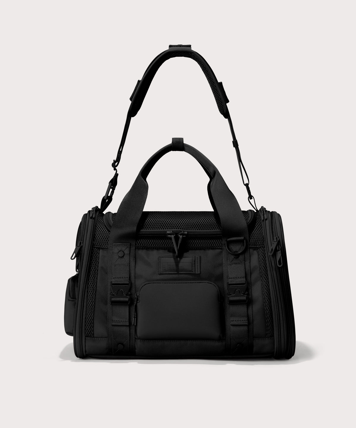 Dagne Dover small Kyoto Pet Carrier in black seen from the front with crossbody strap.
