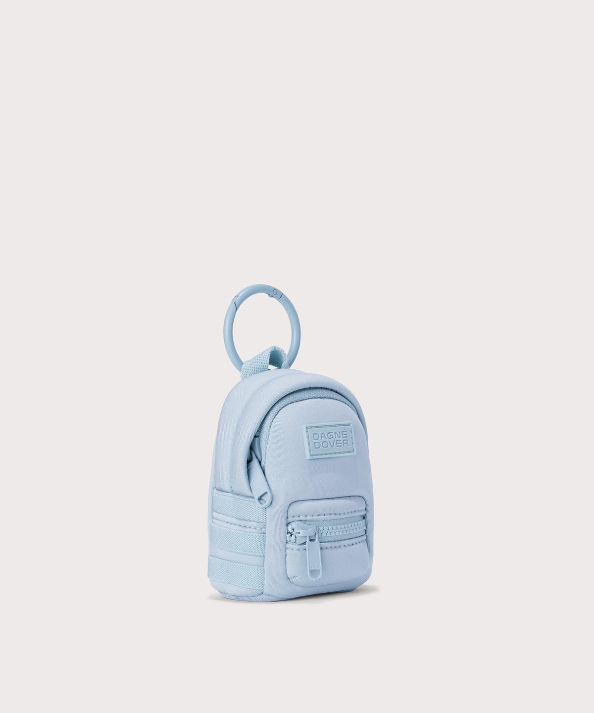 Dagne Dover Dakota Keychain in an airy, lighter sky blue seen from an angle.
