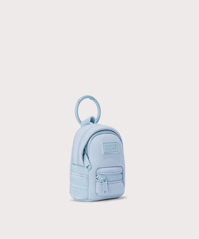 Dagne Dover Dakota Keychain in an airy, lighter sky blue seen from an angle.
