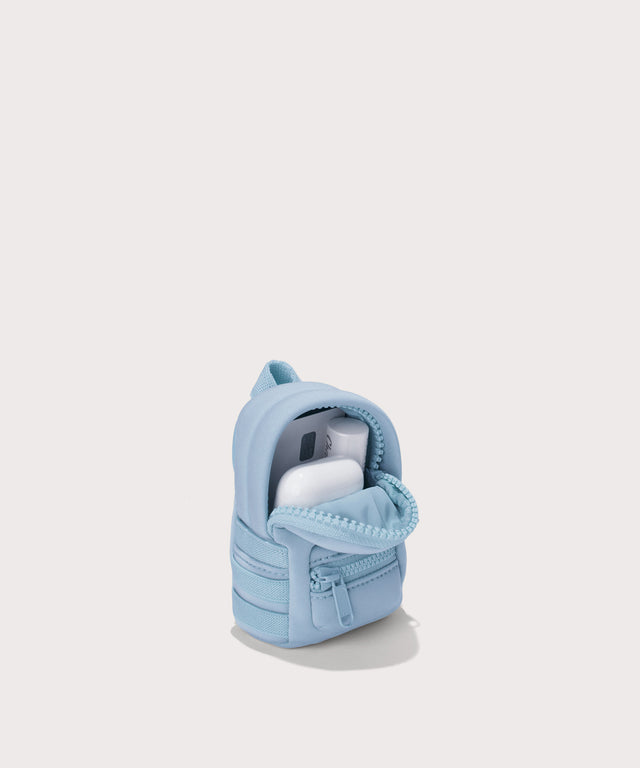 Dagne Dover Dakota Keychain in an airy, lighter sky blue unzipped, showing interior.