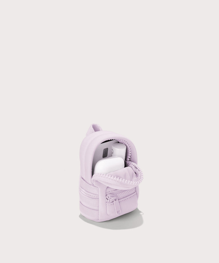 Dagne Dover Dakota Keychain in a soft purple with grey undertones unzipped, showing interior.