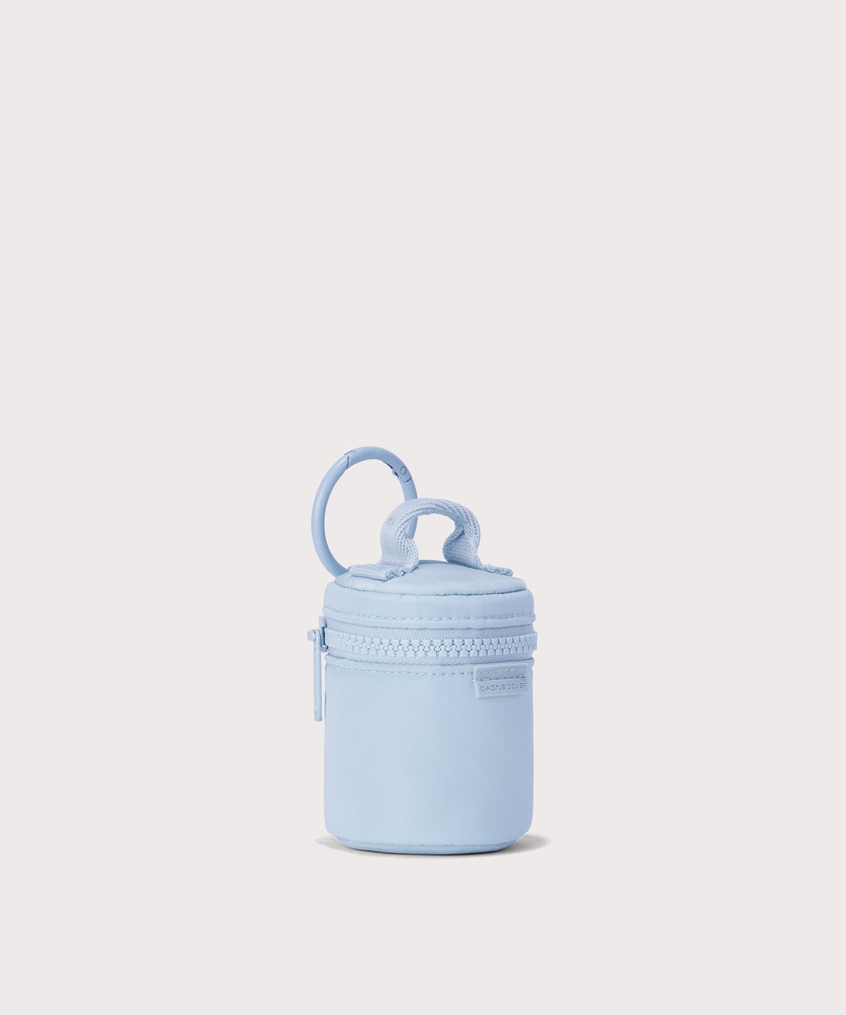 Dagne Dover Mila Keychain in a an airy, lighter sky blue seen from an angle.
