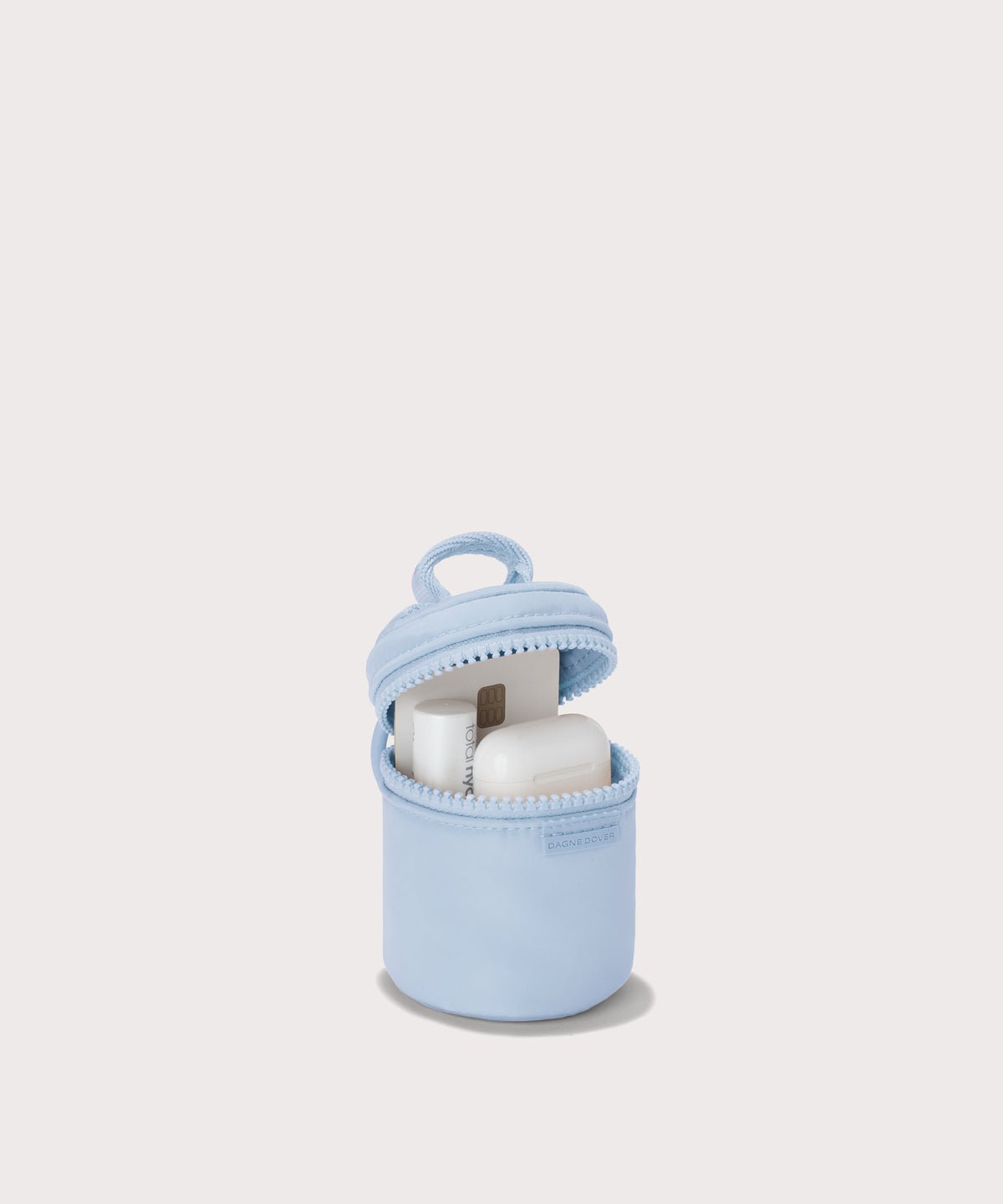 Dagne Dover Mila Keychain in a an airy, lighter sky blue unzipped, showing interior.
