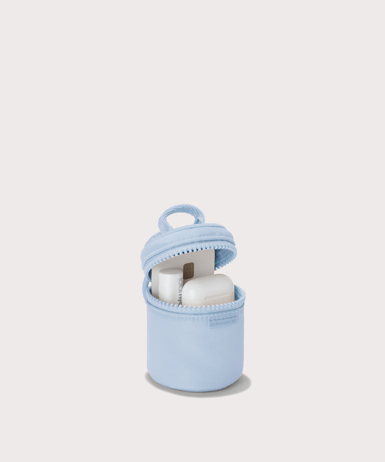 Dagne Dover Mila Keychain in a an airy, lighter sky blue unzipped, showing interior.
