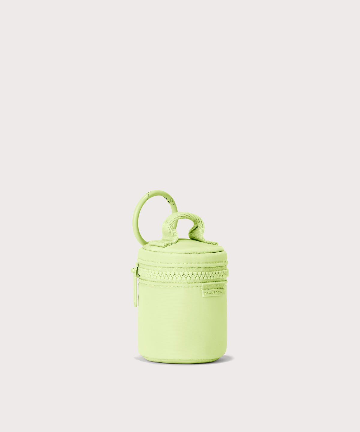 Dagne Dover Mila Keychain in a a vibrant, creamy green seen from an angle.
