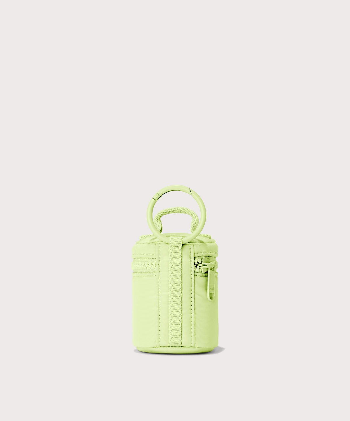 Dagne Dover Mila Keychain in a a vibrant, creamy green seen from the back.
